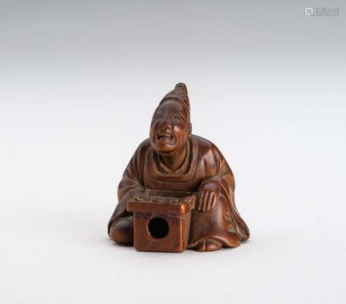 † A FINE WOOD NETSUKE OF A TEMPLE SERVANT