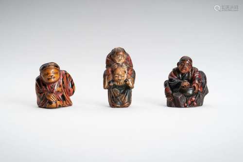 A LOT WITH THREE FIGURAL LACQUERED WOOD NETSUKE