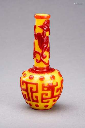 A CARVED RED-OVERLAY YELLOW GLASS BOTTLE VASE, QIANLONG MARK...