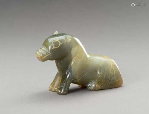 AN ARCHAISTIC SEA-GREEN HARDSTONE FIGURE OF A BEAST, 20TH CE...