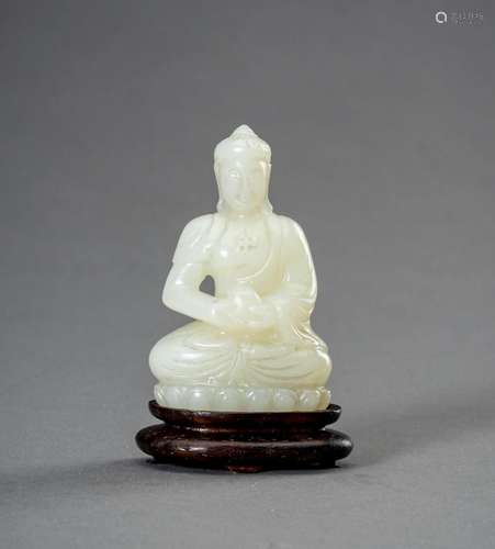 † A PALE CELADON JADE FIGURE OF BUDDHA, 1930s