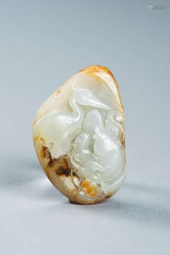 A CELADON AND RUSSET JADE \'FISH AND CRANE\' PENDANT, c. 192...