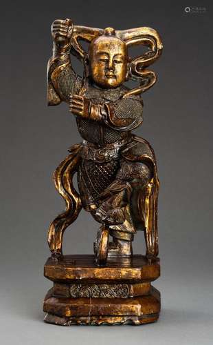 A LACQUER GILT WOOD FIGURE OF NE ZHA, QING