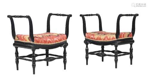 A PAIR OF ITALIAN EBONISED AND UPHOLSTERED DRESSING STOOLS