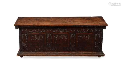 A CARVED OAK COFFER