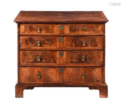 A WALNUT CHEST OF DRAWERS