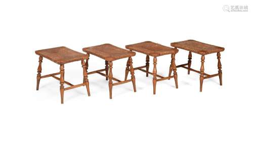 A SET OF FOUR BEECH AND RUSH STOOLS OR LUGGAGE STANDS