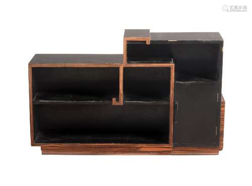 Y AN EBONISED AND SIMULATED ROSEWOOD SHAPED RECTANGULAR BOOK...