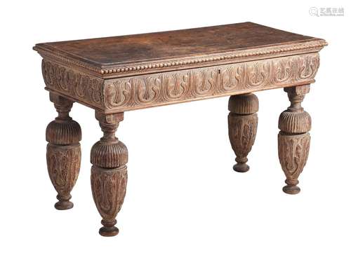 A CARVED AND PARCEL LIMED WOOD SIDE TABLE IN ELIZABETHAN TAS...