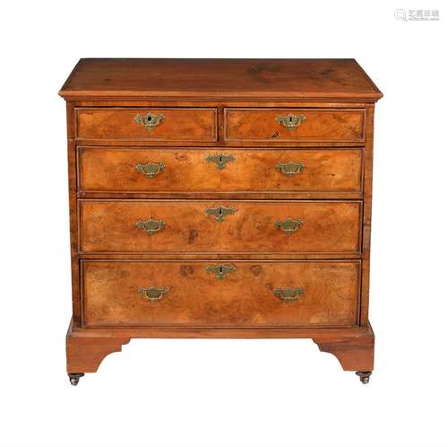 A WALNUT CHEST OF DRAWERS