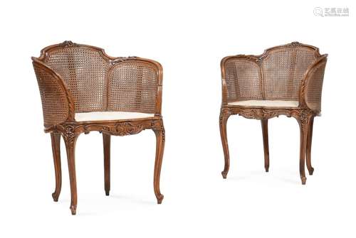 A PAIR OF WALNUT AND CANED BERGÈRE ARMCHAIRS