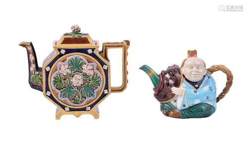 A MINTON MAJOLICA TEAPOT AND COVER MODELLED AS A CHINESE-FIG...