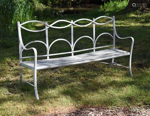 A WHITE PAINTED STRAPWORK BENCH