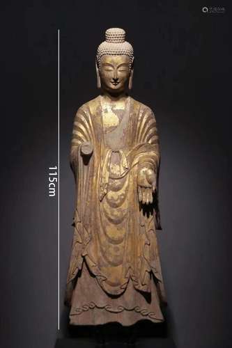 A Carved Stone Standing Buddha