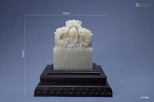 A Carved White Jade Dragon Seal