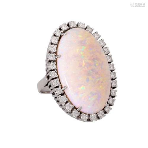 Ring with large opal entouraged by diamonds total ca. 1 ct,