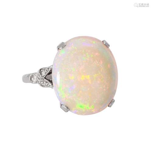 Ring with fine white opal with vivid color play,