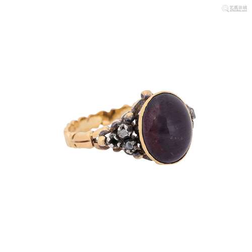 Ring with garnet cabochon and diamond roses,