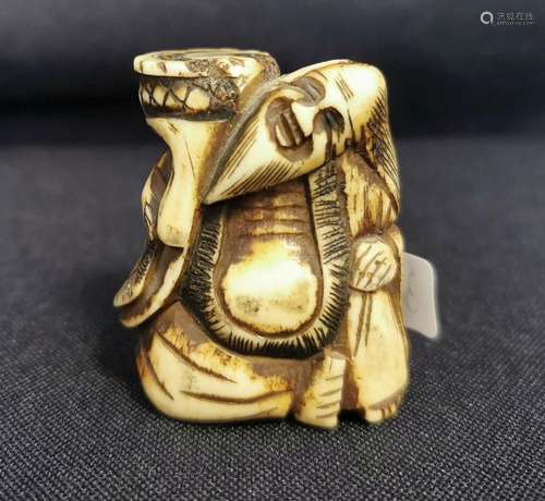 NETSUKE: MAN WITH BASKET