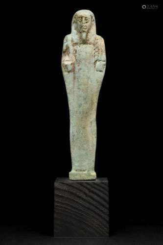 AN ANCIENT EGYPTIAN FAIENCE USHABTI
