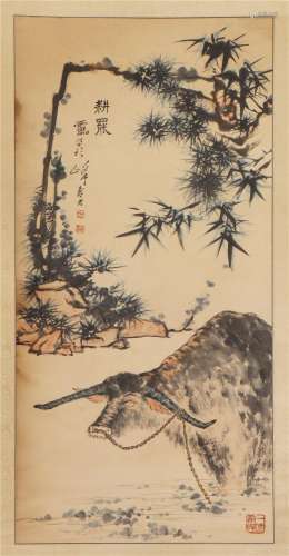 A CHINESE PAINTING OF A CATTLE AND BAMBOO