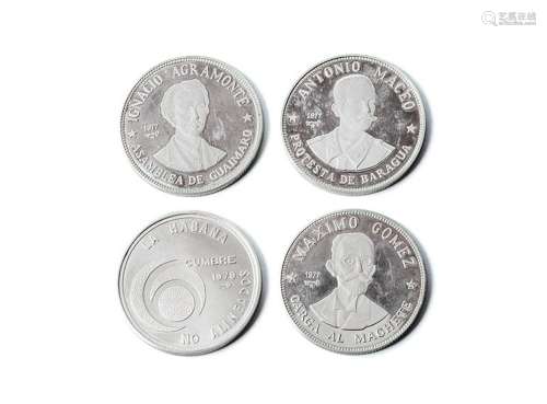 Lote de cuatro monedas de plata (925 mil): 20 pesos. Repúbli...