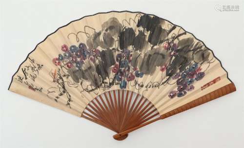 A CHINESE PAINTING OF GRAPES ON FOLDING FAN