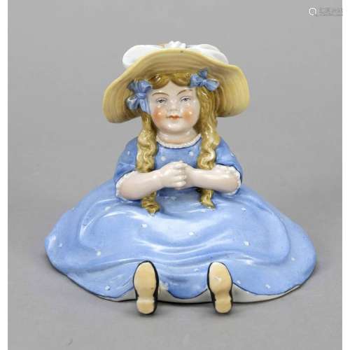Sitting girl with straw hat and b
