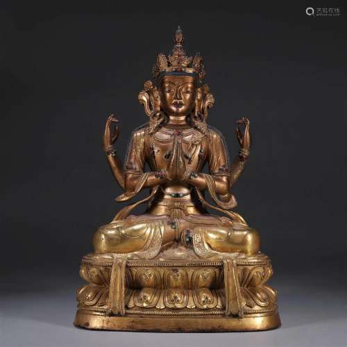 A gilding copper four-armed Guanyin statue
