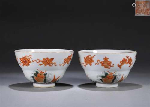 A pair of iron red eight treasures porcelain bowls