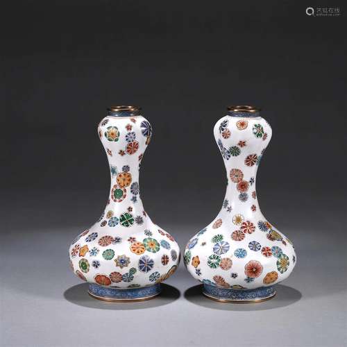 A pair of flower patterned copper enamel vases