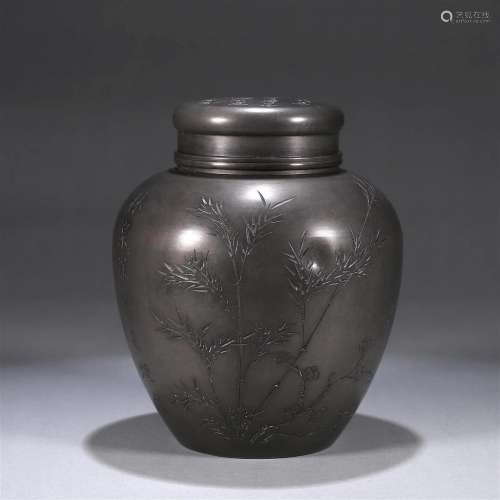 An inscribed bamboo tin jar