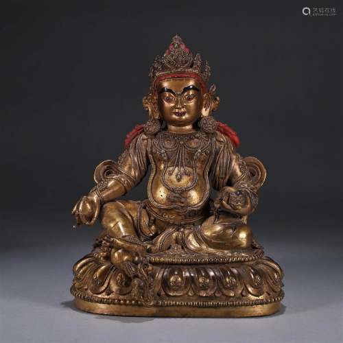 A gilding copper buddha statue