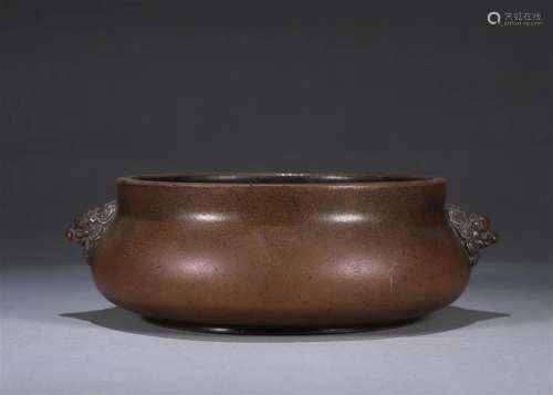 A copper censer with lion shaped ears