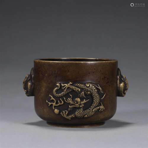 A dragon patterned copper censer with lion shaped ears
