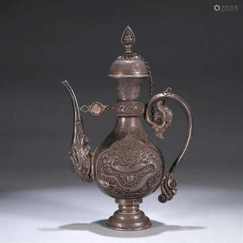 A dragon patterned silver pot