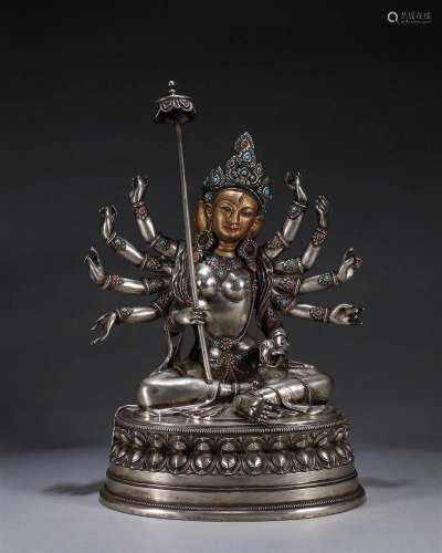 A silver gem-inlaid usnisa-sitapatra buddha statue
