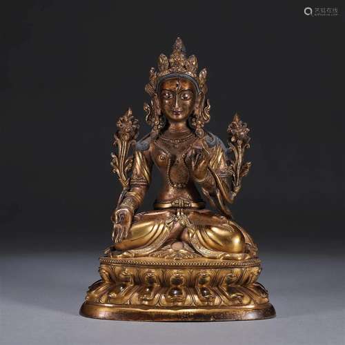 A gilding copper buddha statue