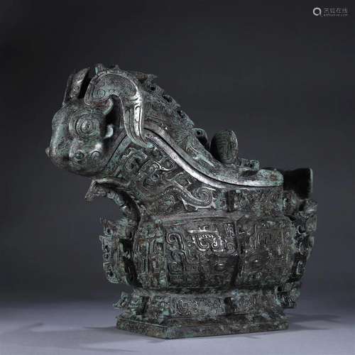 A taotie patterned bronze goat head pot