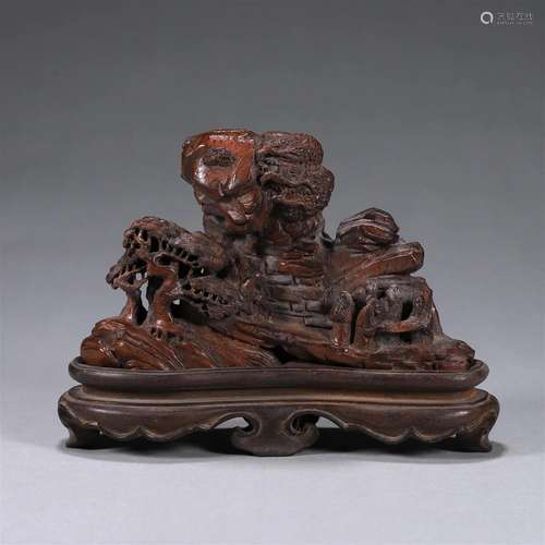 A landscape and figure carved bamboo ornament