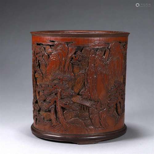 A landscape and figure carved bamboo brush pot