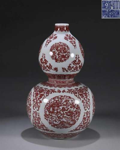 An underglaze red dragon porcelain gourd shaped vase