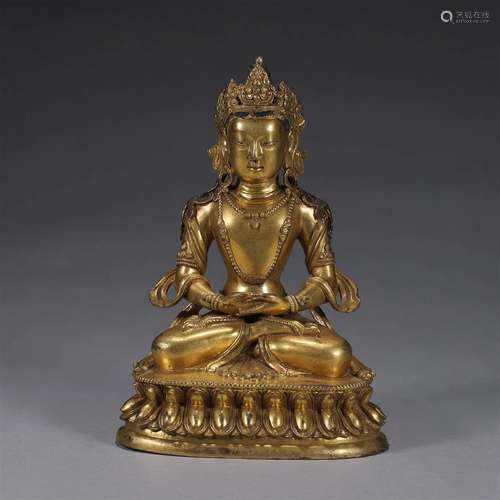 A gilding copper buddha statue