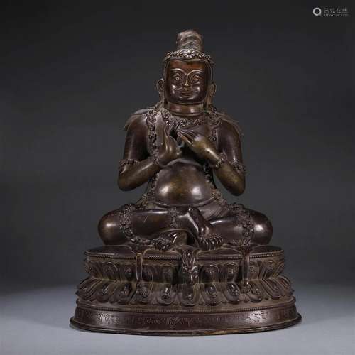 A copper buddha statue