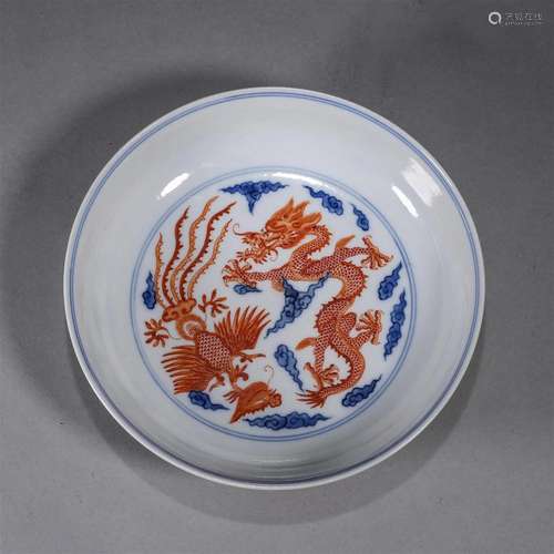 A blue and white iron red dragon and phoenix porcelain plate