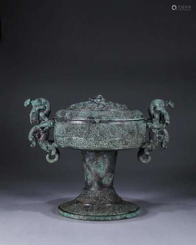 A bronze pot with dragon shaped ears