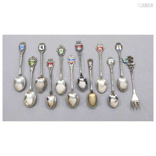 Eleven souvenir spoons and one fork,