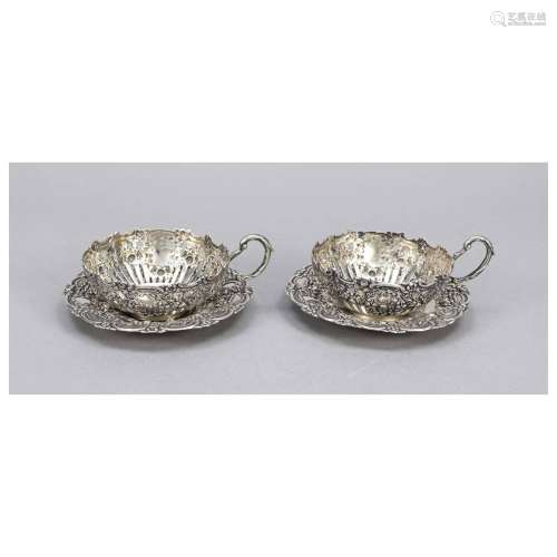 Pair of tea cup mounts with saucers,