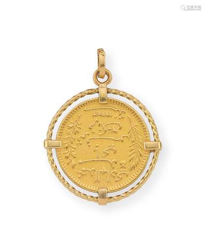 Pendentif en or jaune, orné d’une pièce de 20 Francs Tunisie...