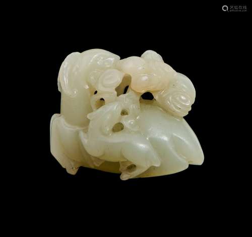 A CHINESE WHITE JADE GROUP OF A MYTHICAL BEAST, 18TH CENTURY...